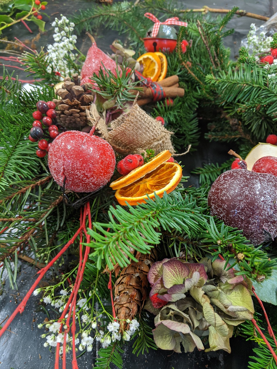 Fruit and Pine Wreath: Holiday wreath made with fresh pine clippings, apples, and oranges.